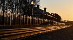 The station illuminated by the setting sun